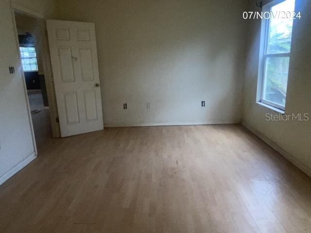 spare room featuring light hardwood / wood-style floors