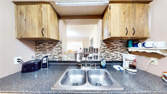 kitchen with sink and tasteful backsplash