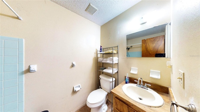 bathroom with vanity, a textured ceiling, toilet, a shower, and lofted ceiling