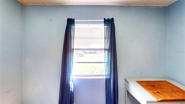 interior space with a textured ceiling