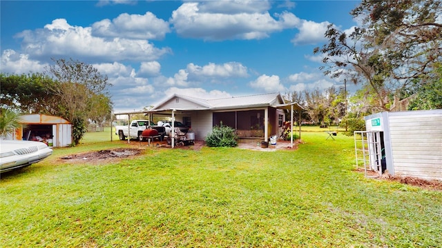 view of yard featuring a storage unit and a carport