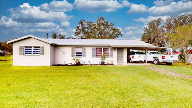 single story home featuring a front yard and a carport