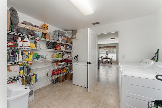 washroom with washer and dryer