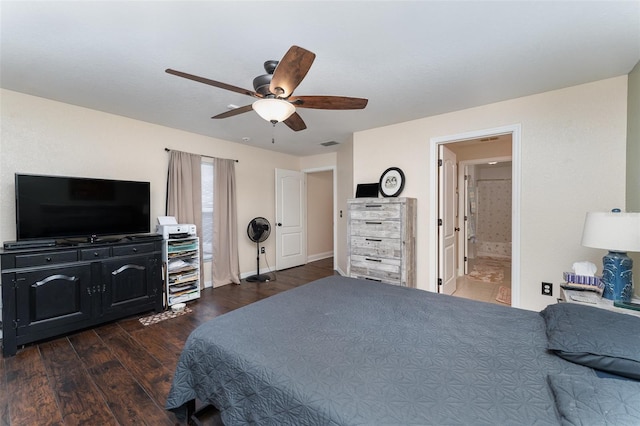 bedroom with ceiling fan, dark wood-type flooring, and ensuite bath