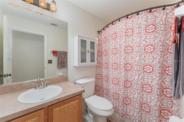 bathroom with toilet and vanity