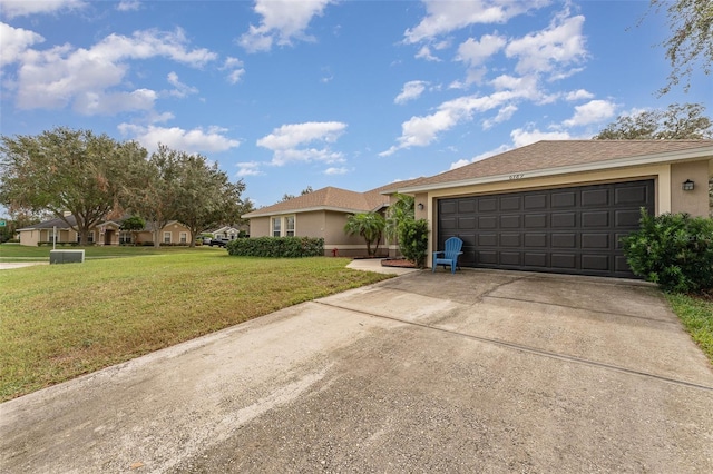 ranch-style home with a garage and a front yard