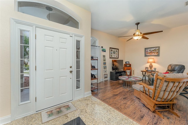 foyer featuring ceiling fan and hardwood / wood-style floors