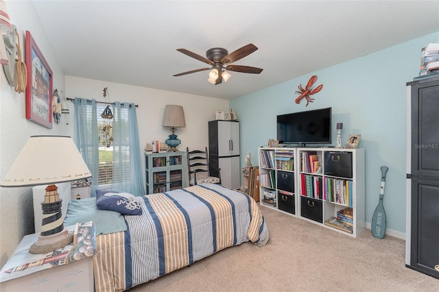 carpeted bedroom featuring ceiling fan