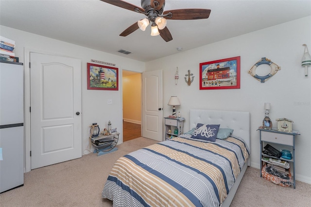 carpeted bedroom featuring ceiling fan