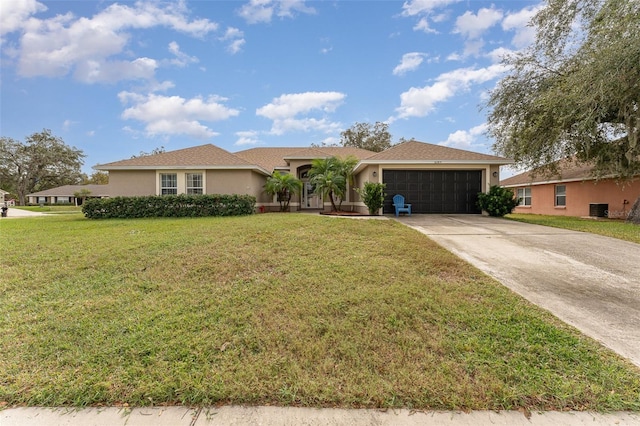 ranch-style home featuring a front lawn and a garage