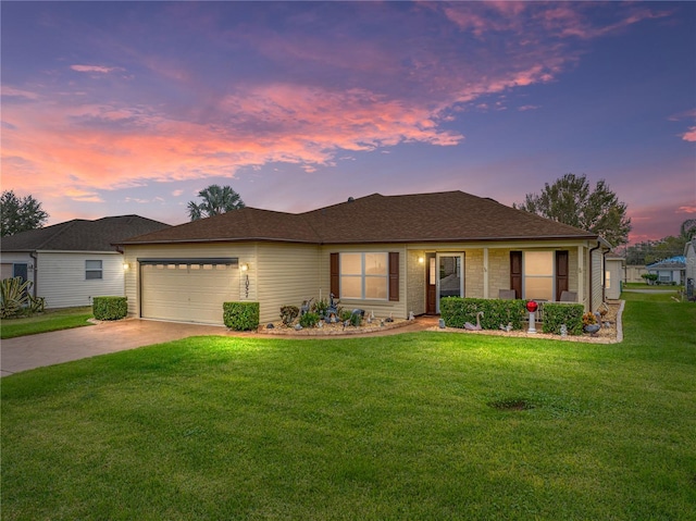 view of front facade featuring a lawn and a garage