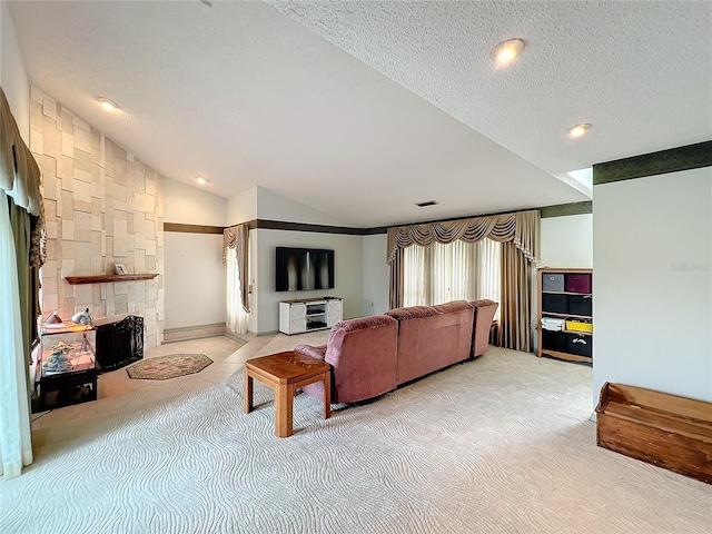 living room featuring a stone fireplace, a textured ceiling, vaulted ceiling, and carpet floors