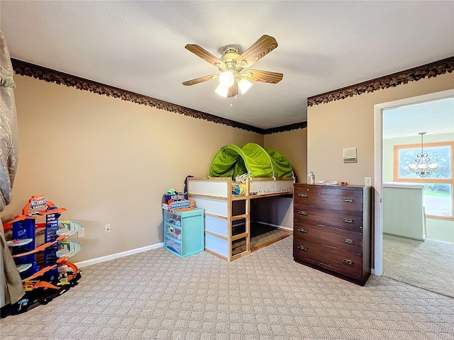 carpeted bedroom with ceiling fan with notable chandelier