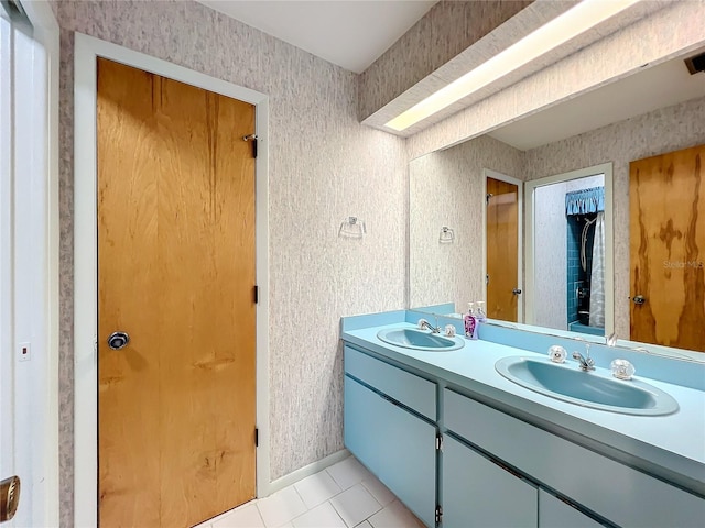 bathroom with tile patterned flooring and vanity