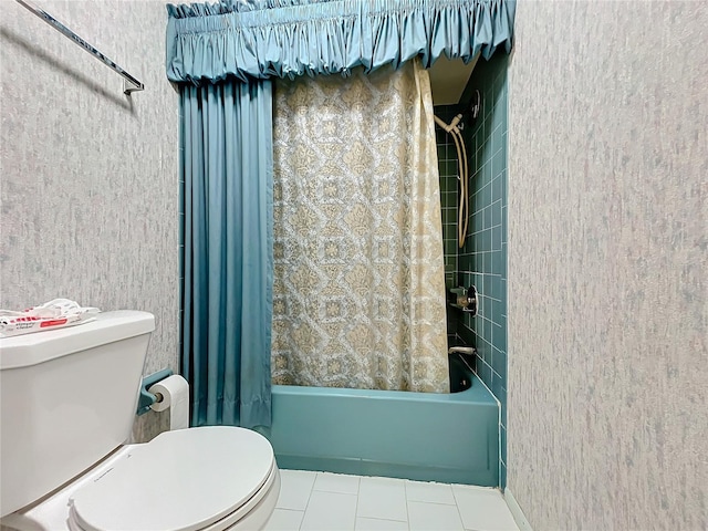 bathroom with toilet, tile patterned floors, and shower / tub combo with curtain