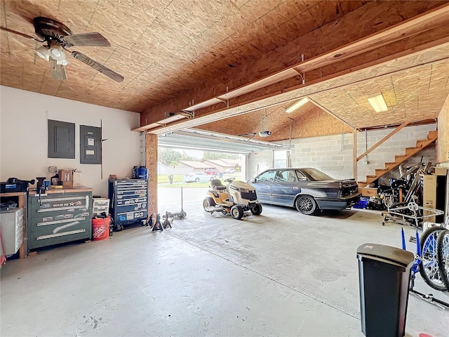 garage featuring electric panel and ceiling fan