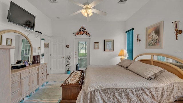 bedroom with access to outside, light colored carpet, and ceiling fan