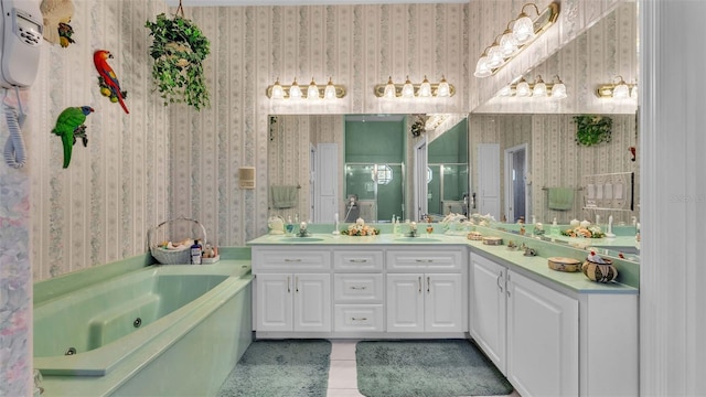 bathroom with vanity, a tub, and tile patterned flooring