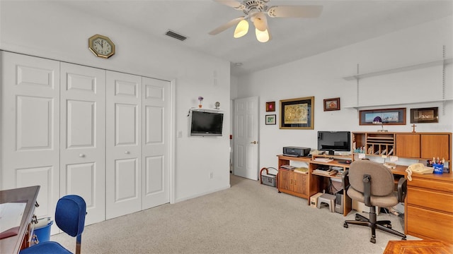 carpeted office featuring ceiling fan