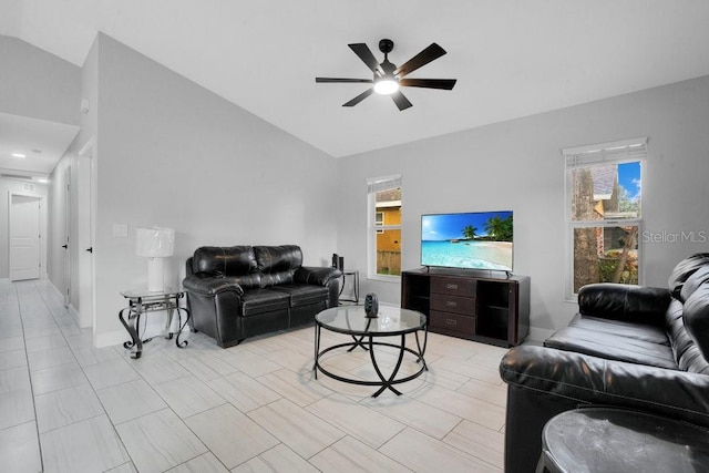 living room with ceiling fan and vaulted ceiling