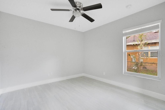 spare room featuring ceiling fan and light wood-type flooring