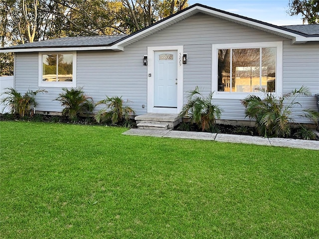 view of front of home with a front lawn