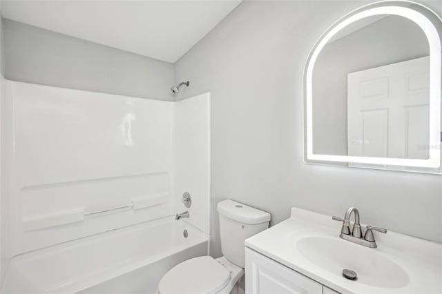 full bathroom featuring vanity, bathtub / shower combination, and toilet