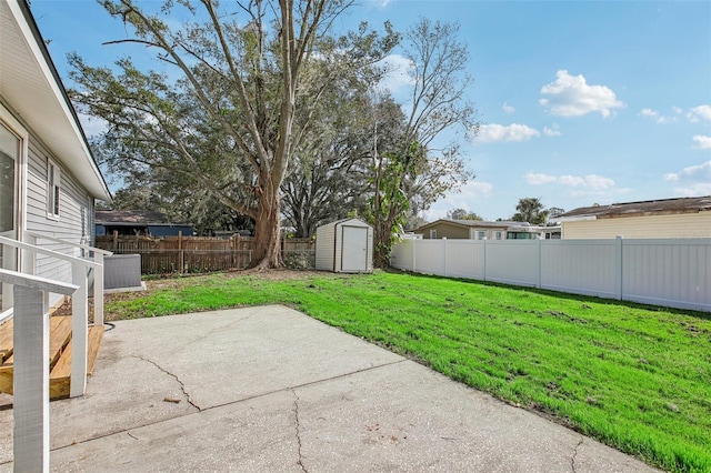 view of yard with a patio and a shed