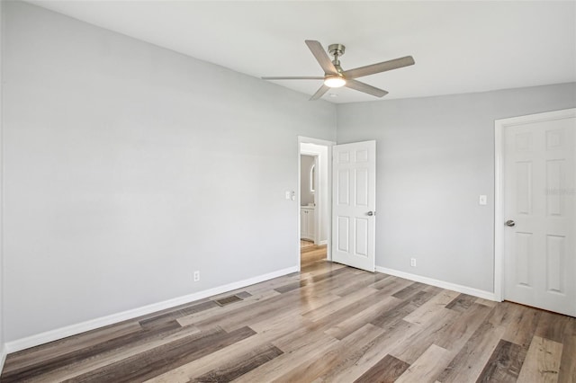 unfurnished bedroom with ceiling fan and light hardwood / wood-style floors