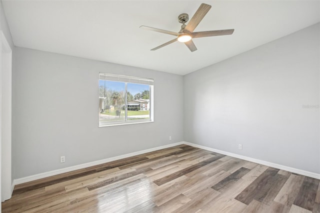 unfurnished room featuring ceiling fan and light wood-type flooring