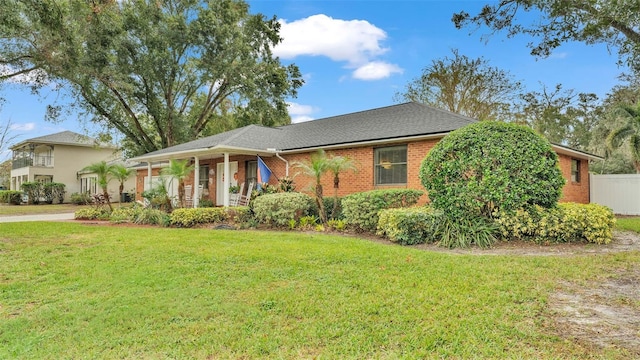 single story home with a front yard