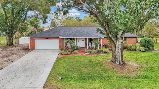 single story home featuring a garage and a front lawn