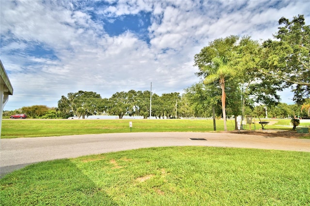 view of home's community featuring a lawn