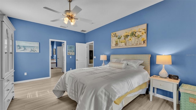 bedroom with light hardwood / wood-style floors and ceiling fan