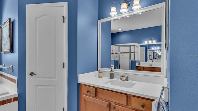 bathroom with vanity and walk in shower