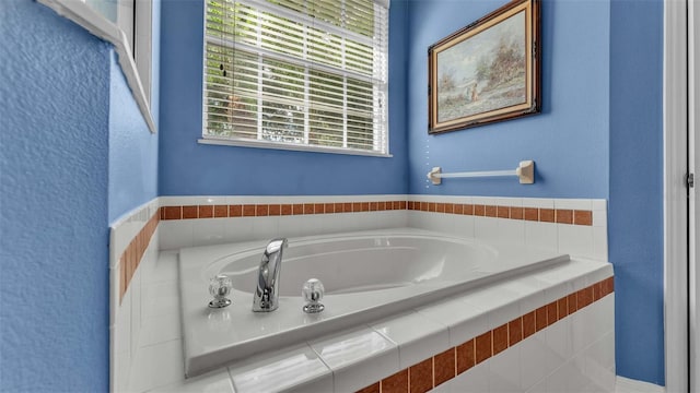 bathroom with tiled bath