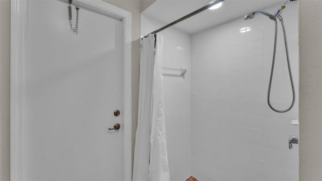 bathroom with a shower with shower curtain