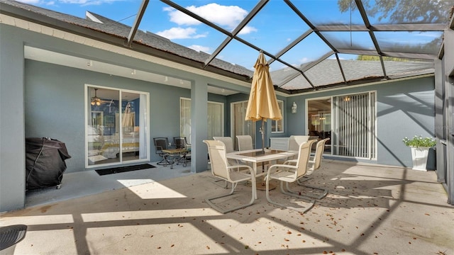 view of patio featuring a lanai