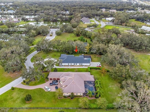 birds eye view of property with a water view