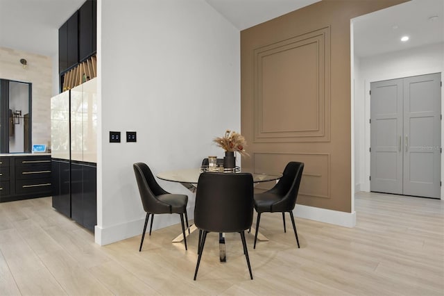 dining room with light wood-type flooring