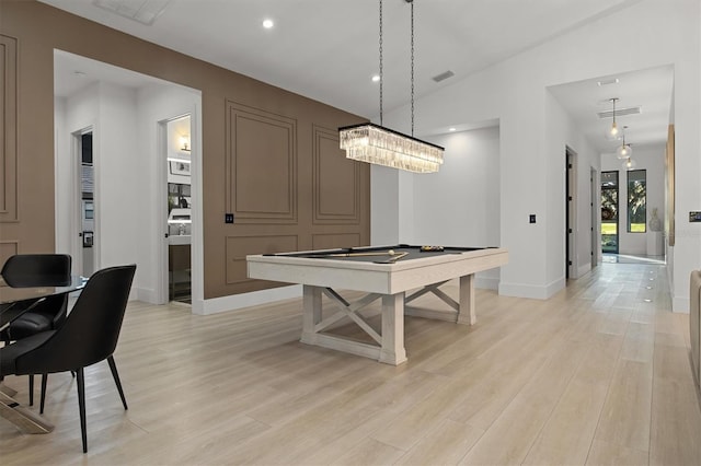 rec room with billiards, light wood-type flooring, and lofted ceiling