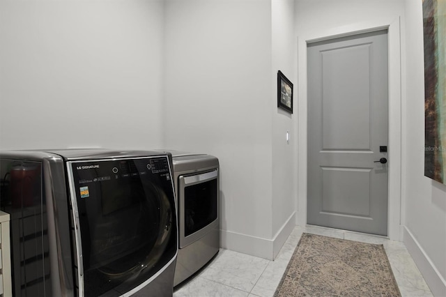 laundry area featuring washer and clothes dryer