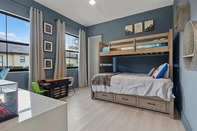 bedroom featuring light hardwood / wood-style flooring and ceiling fan