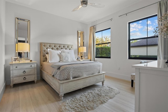 bedroom featuring ceiling fan and light hardwood / wood-style flooring