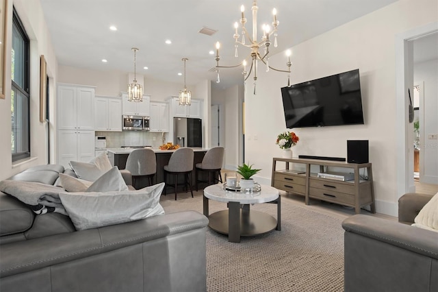 living room featuring an inviting chandelier