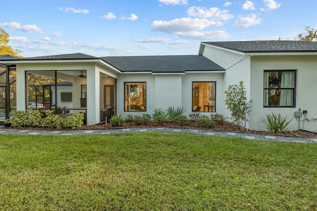 exterior space with a lawn and ceiling fan