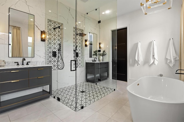 bathroom with tile walls, vanity, tile patterned floors, and independent shower and bath