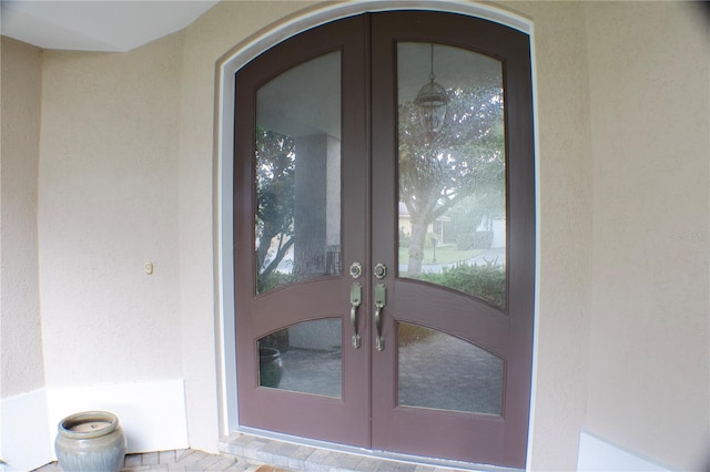 property entrance featuring french doors