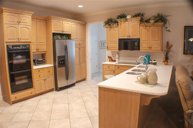 kitchen featuring light brown cabinetry, sink, black appliances, and crown molding