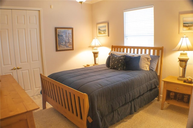 carpeted bedroom with a closet